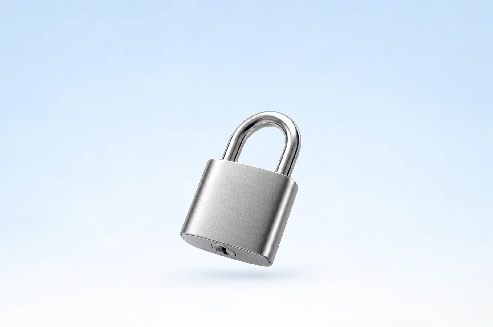 A glass padlock on a pale blue surface