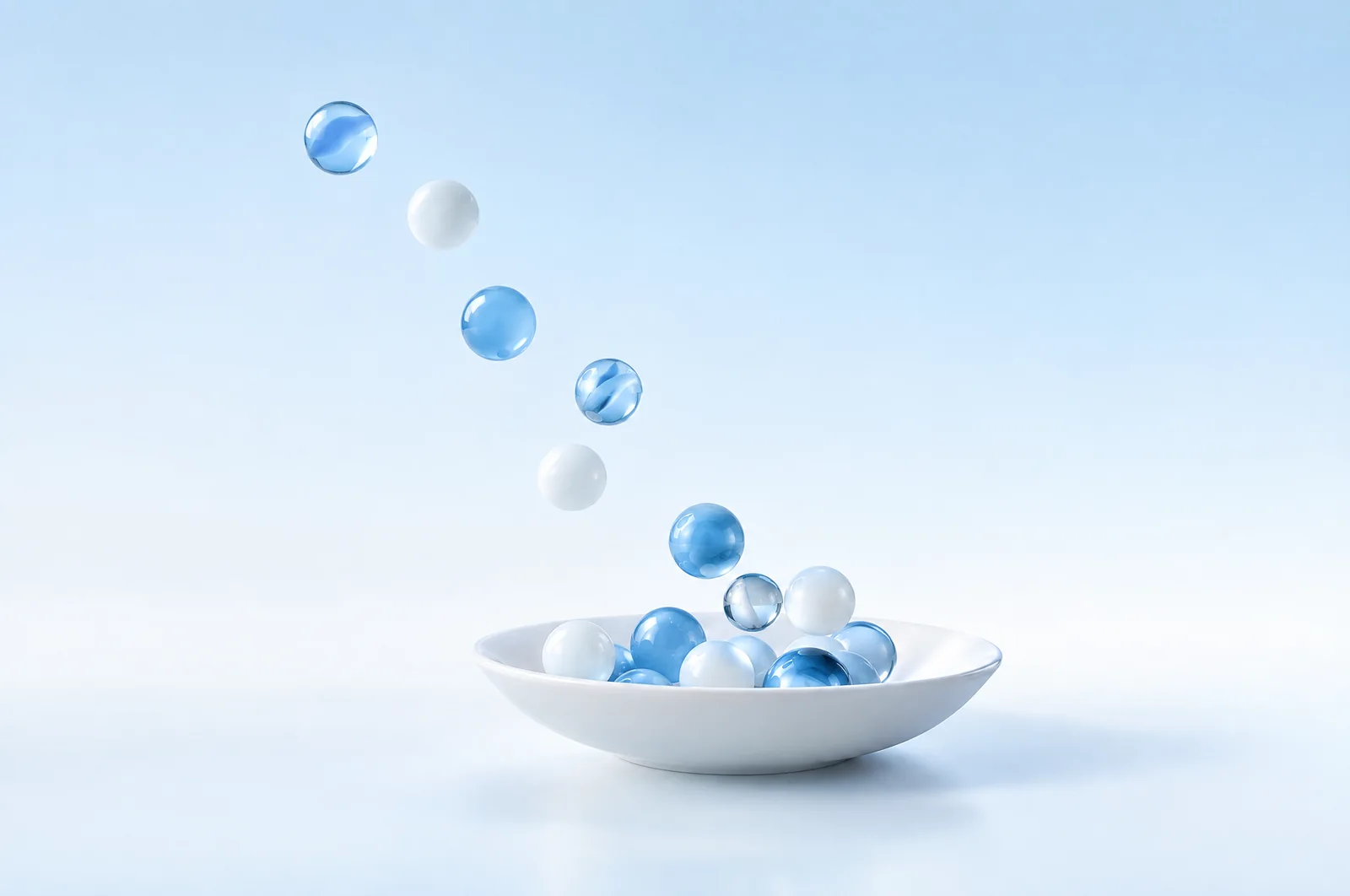 Glass spheres floating above a calm blue pool