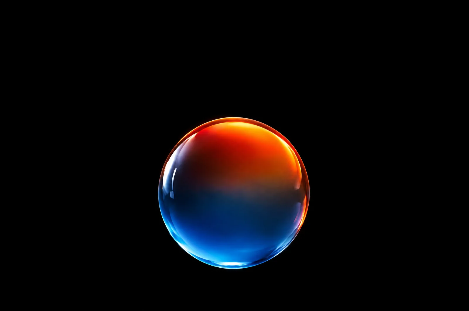 A glass orb shifting from icy blue to glowing orange